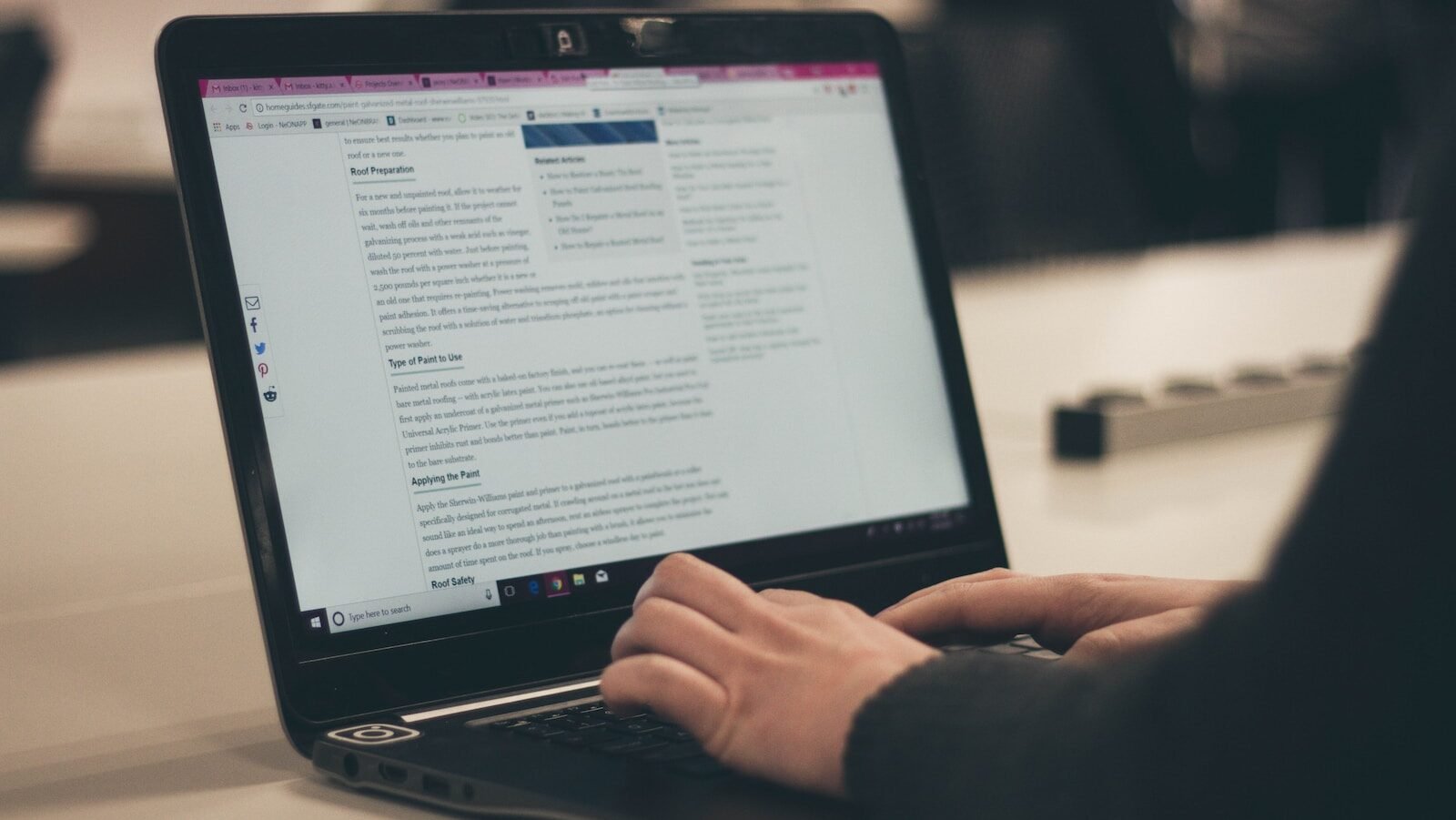 person typing on laptop computer